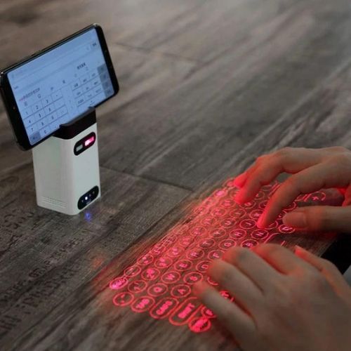 Laser Tastatur: Kompakt und kabellos für unterwegs-Erleben Sie die Zukunft mit der Laser tastatur, die eine vollwertige auf jede flache Oberfläche projiziert. Bestellen Sie jetzt und tippen Sie überall!